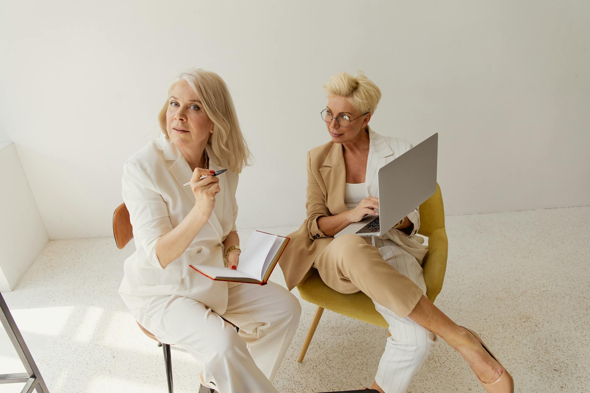 A diverse couple having an intimate and open conversation while sitting together on a comfortable sofa at home.